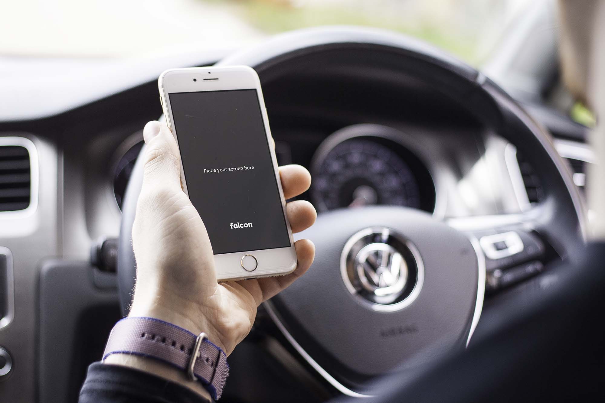 Free iPhone 6S in Car Mockup (PSD)