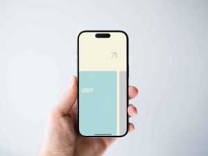 Free iPhone Held in Hand Mockup (PSD)