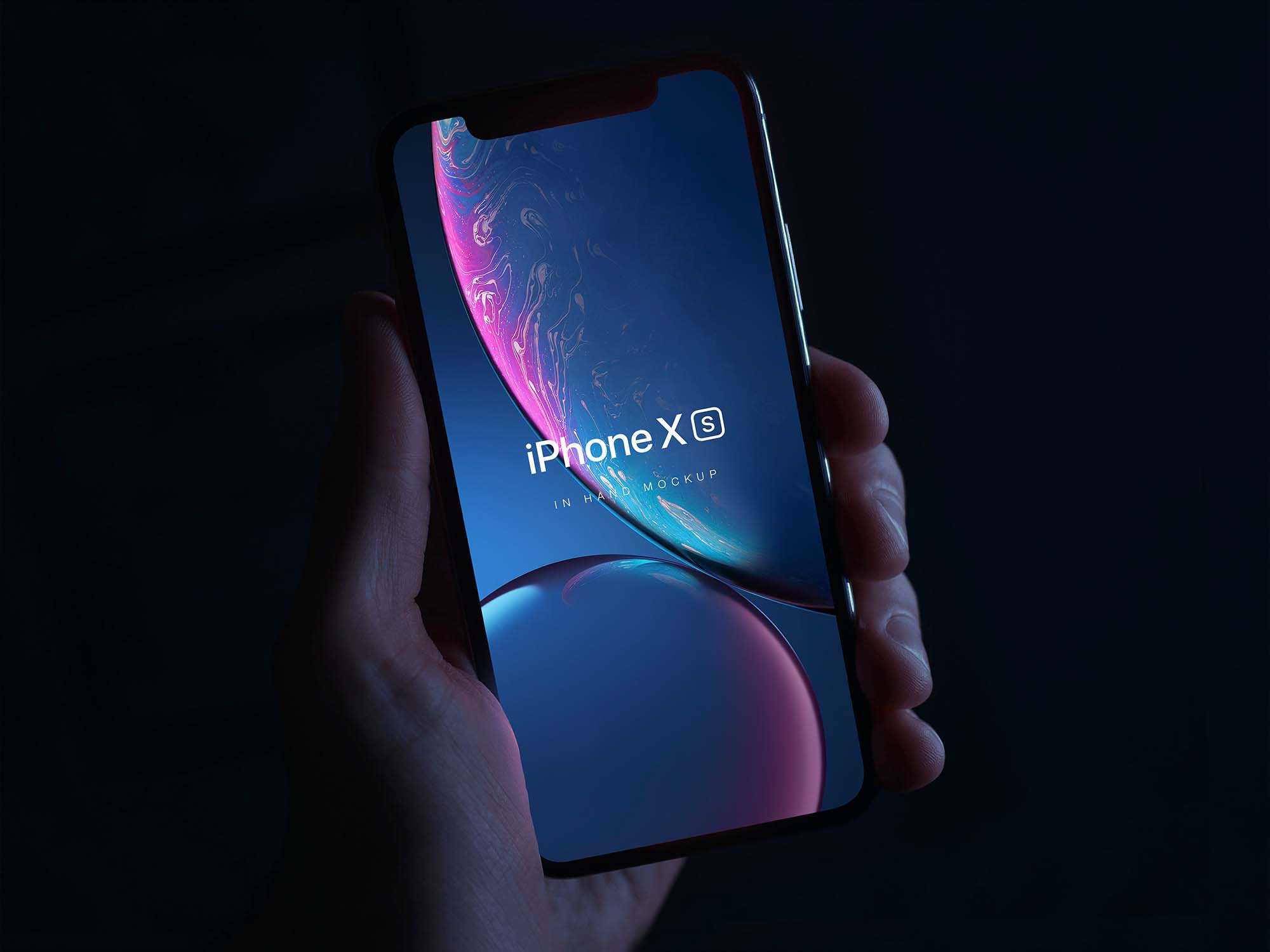 Free iPhone XS in Hand Mockup (PSD)
