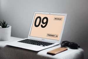 Free MacBook Air on Table Mockup (PSD)