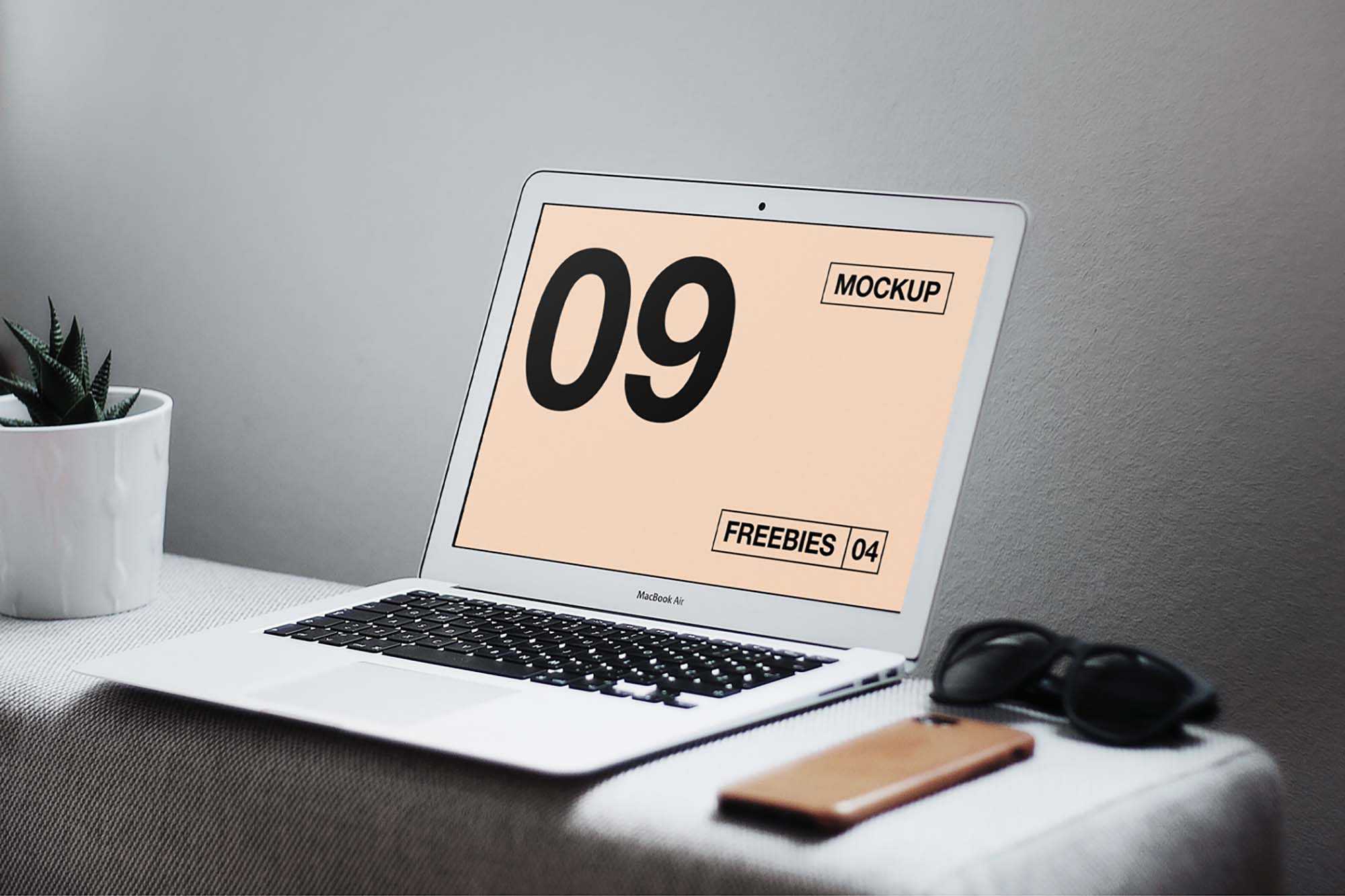 Free MacBook Air on Table Mockup (PSD)