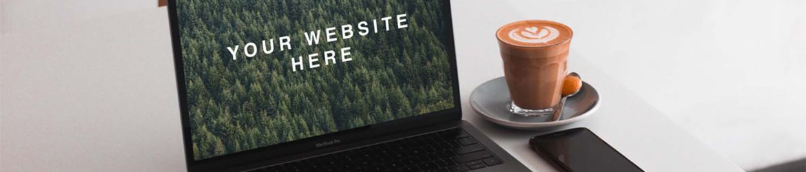 Free MacBook on Table Mockup (PSD)