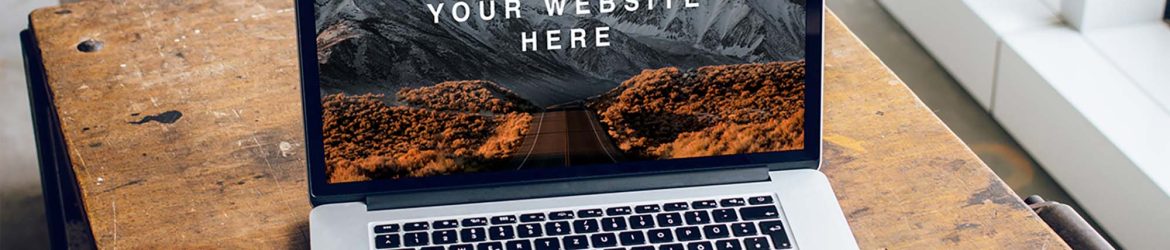 Free MacBook Pro on Table Mockup (PSD)