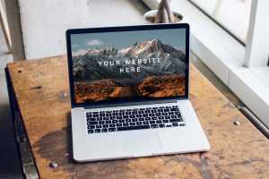 Free MacBook Pro on Table Mockup (PSD)