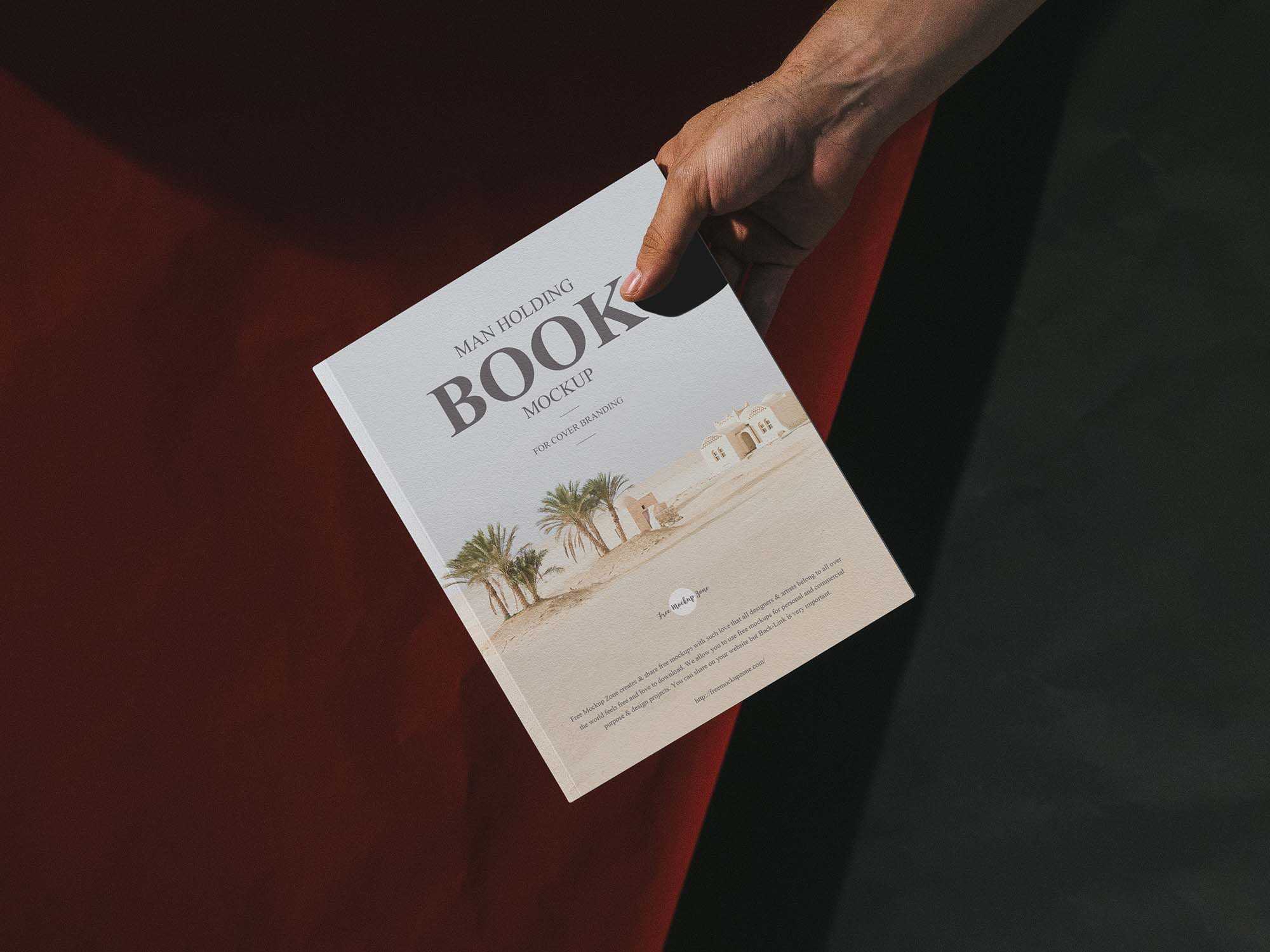 Free Man Holding Book Mockup (PSD)