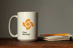 Free Mug on Table Mockup (PSD)