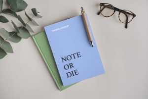 Free Notebook with Pen Mockup (PSD)