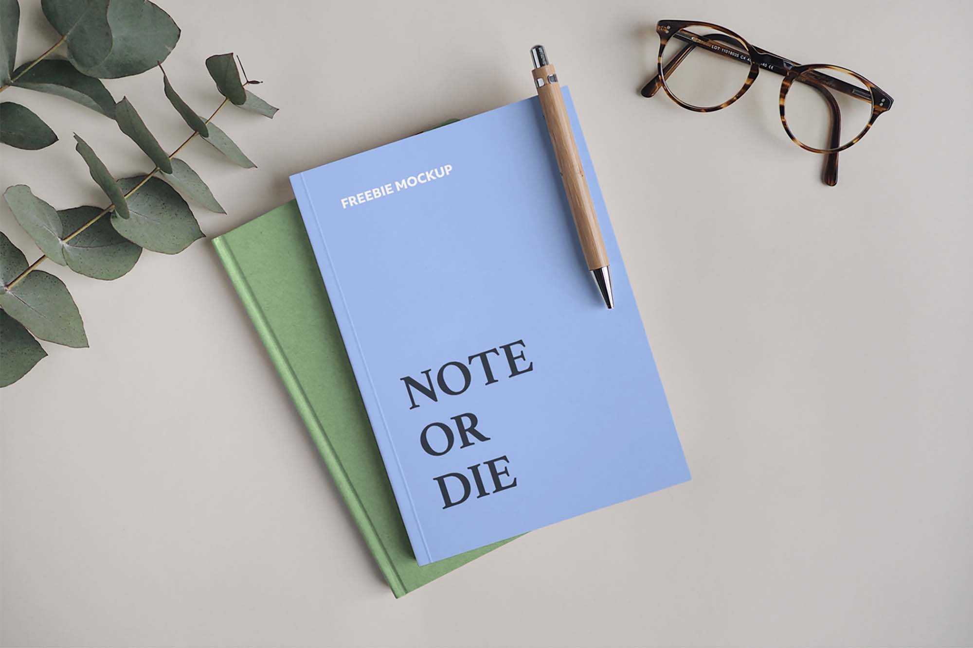 Free Notebook with Pen Mockup (PSD)