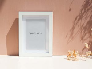 Free Portrait Wood Photo Frame Mockup (PSD)