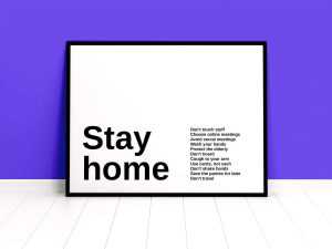 Free Poster Against Wall Mockup (PSD)