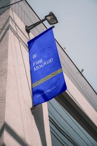 Free Vertical Flag on Building Mockup (PSD)