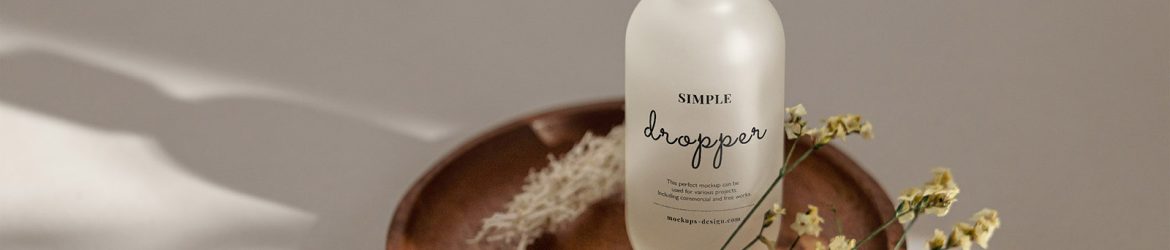 Frosted dropper bottle on wooden tray mockup
