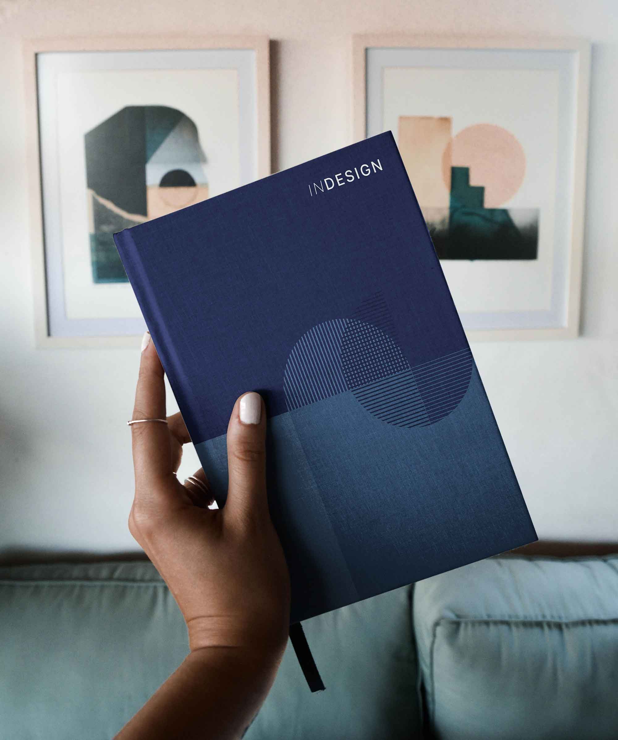 Hardback Book in Hand Mockup (PSD)