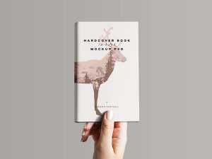 Hardcover Book in Hand Mockup (PSD)