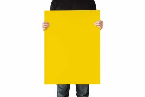 Man Holding a Poster Free Mockup (PSD)