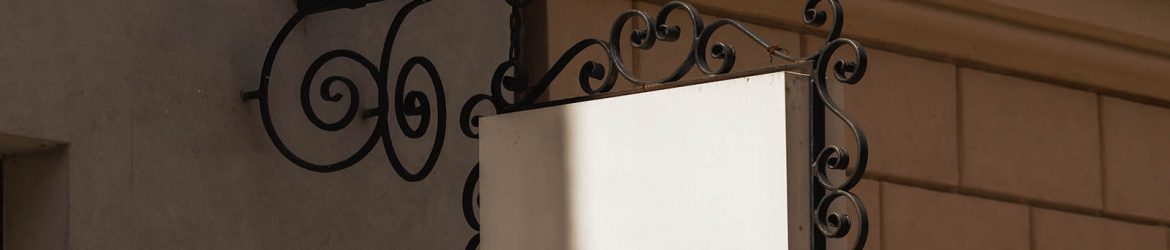 Ornate hanging wrought iron signboard mockup Ornate hanging wrought iron signboard mockup
