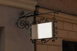 Ornate hanging wrought iron signboard mockup