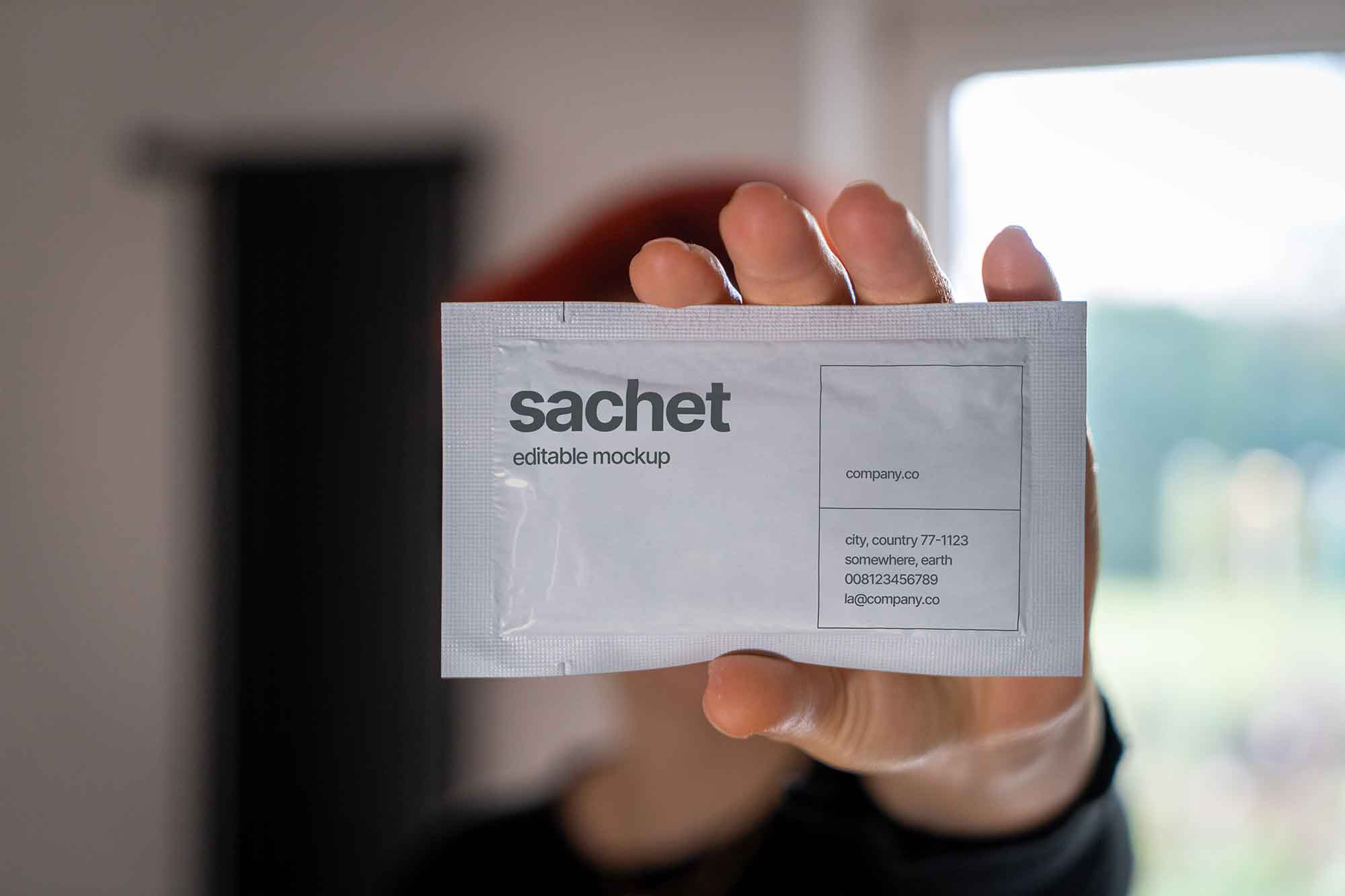 Sachet in Hand Mockup