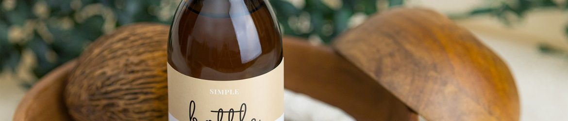 Sirup bottle on wooden tray mockup Sirup bottle on wooden tray mockup