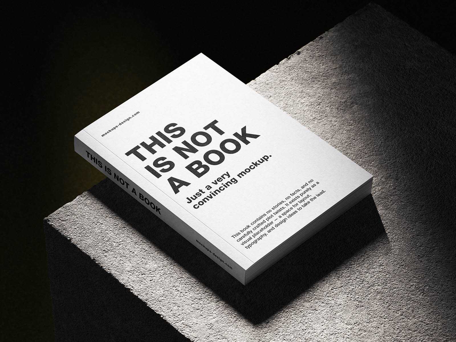 Softcover book on concrete mockup