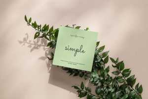 Square flyer on green leafs mockup