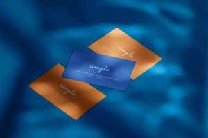 Three business cards on blue background mockup