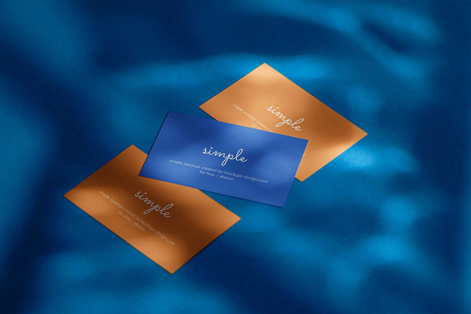 Three business cards on blue background mockup