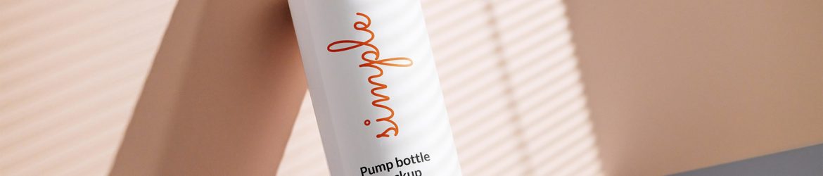 White pump bottle lying on wall mockup White pump bottle lying on wall mockup