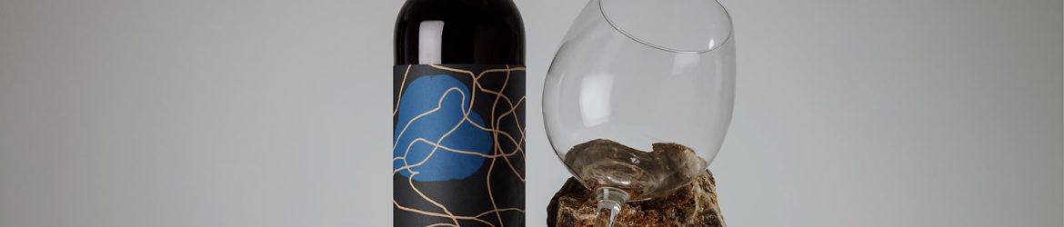 Wine bottle with a glass mockup