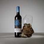 Wine bottle with a glass mockup