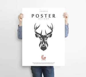 Advertisement Poster Mockup Held By a Man (PSD)