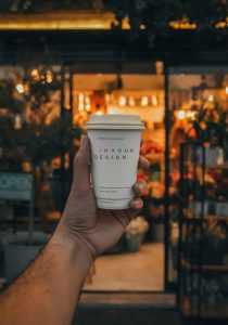Coffee Cup in Hand Mockup