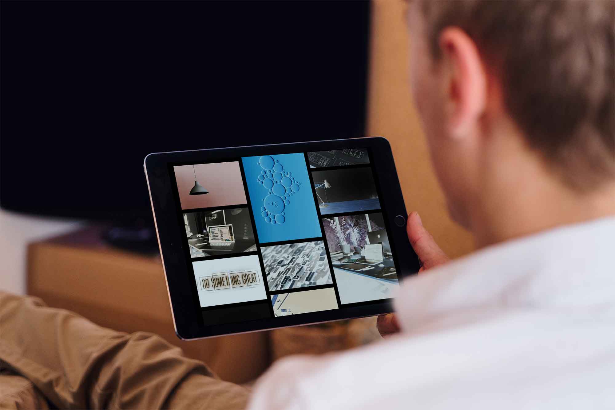 Free Handheld iPad Photo Mockup (PSD)