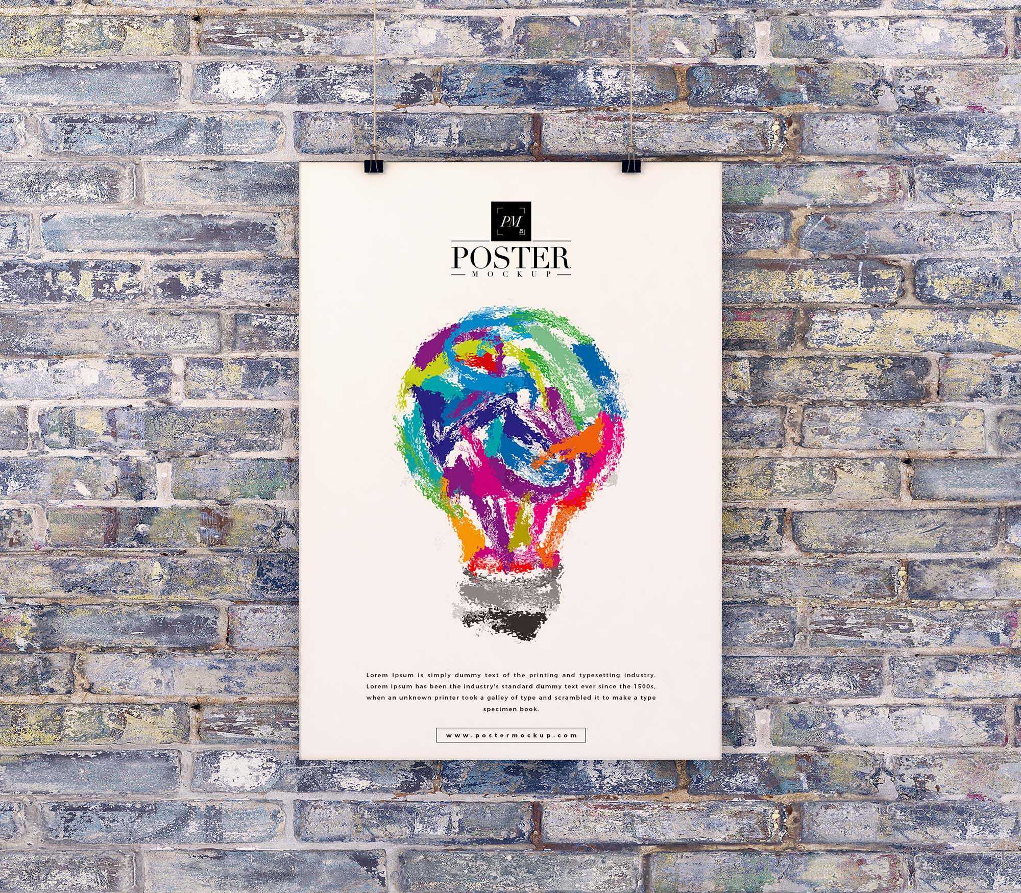 Free Poster on Brick Wall Mockup (PSD)