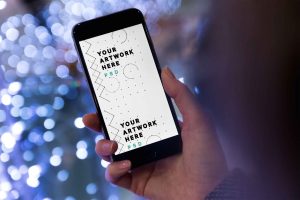 iPhone Held by Hand Mockup