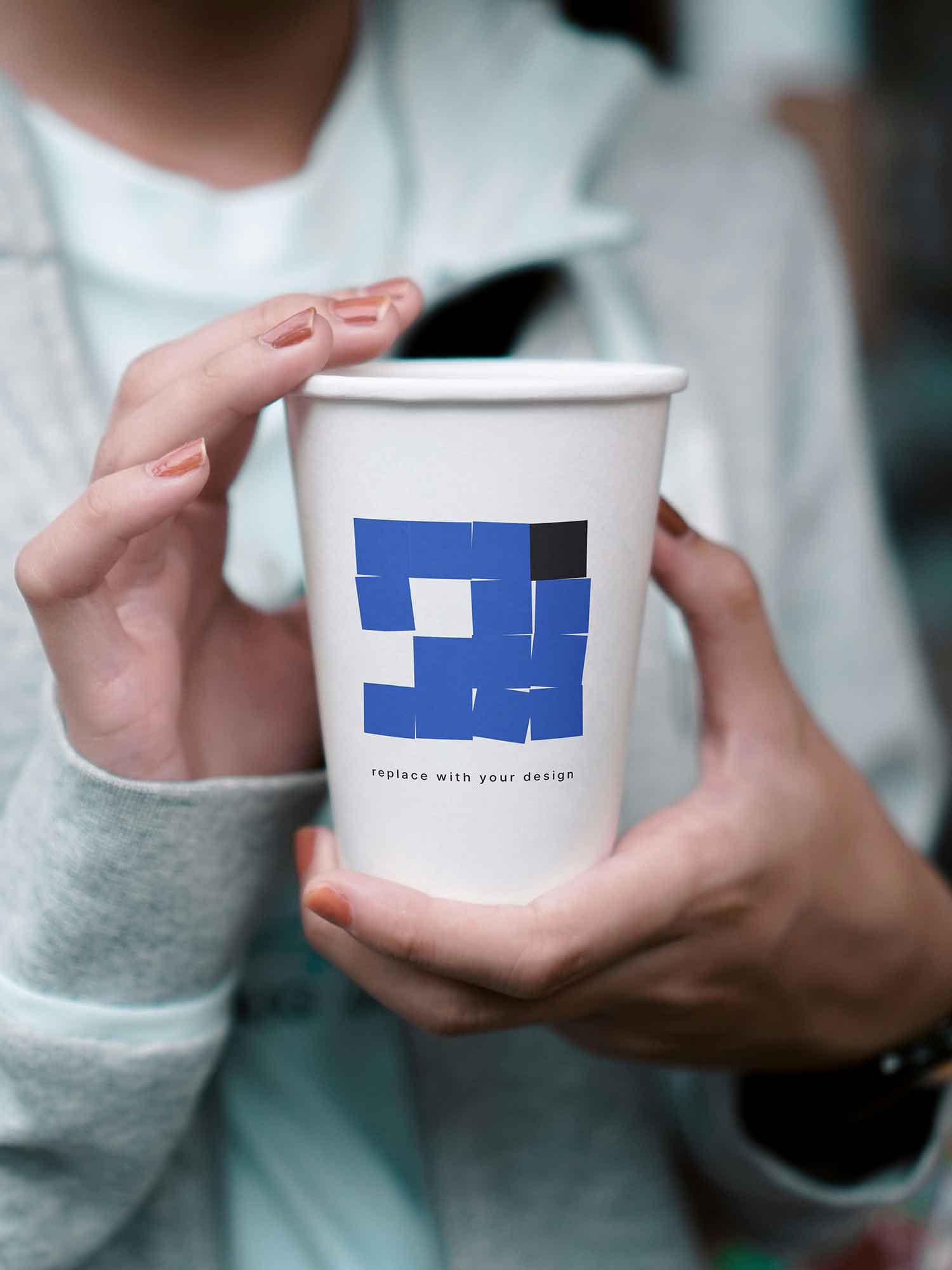 Paper Cup in Hand Mockup